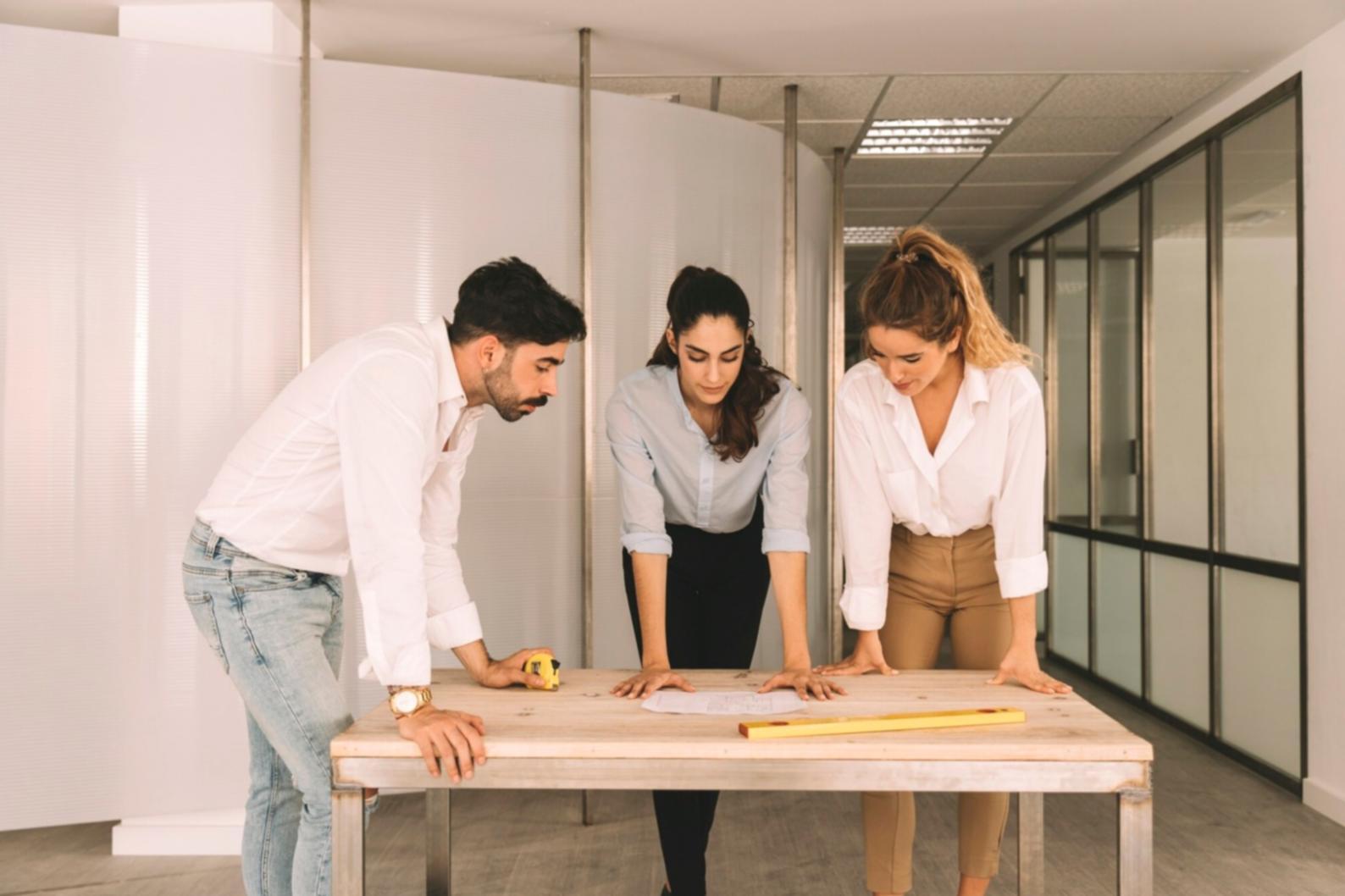 Strategic planning session with marketing materials and analysis documents